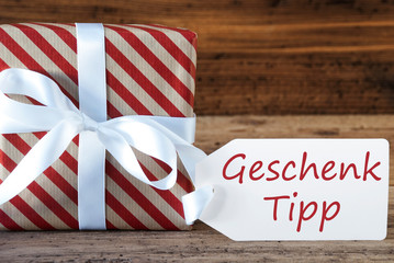 Fototapeta na wymiar Present With Label, Geschenk Tipp Means Gift Tip