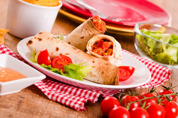 Tortilla wraps with chicken and vegetable. 