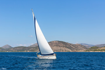 Naklejka na ściany i meble Sailboats participate in sailing regatta. Luxury Yachts.