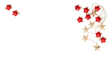Christmas ornaments Golden stars red baubles flat lay
