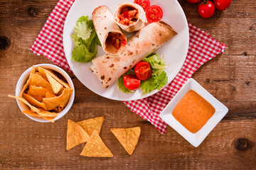 Tortilla wraps with chicken and vegetable. 
