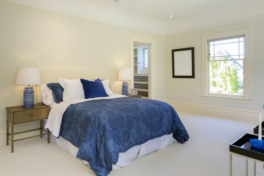 Amazing bedroom with blue decoration in luxury home with copy space.