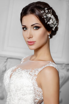 Beautiful bride in fashion wedding dress with diamond jewelry 