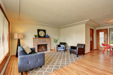 Classic living room interior brick trimmed fireplace.