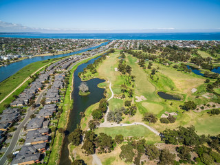 Aerial view of Bonbeach suburb, Patterson river and golf club on bright sunny day. Melbourne,...