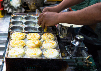 Taiwanese street food : Taiwanese style Egg burger with various condiments and flavour in night market 