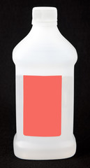 Opaque plastic jar of rubbing alcohol with blank label. Vertical.