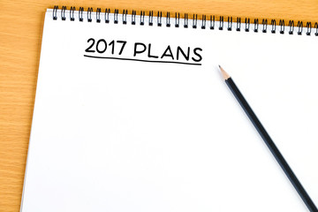 2017 plans on blank paper notebook background