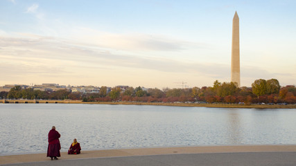Red robed monks pause for photos at the Tidal Basin in Washington, DC. 