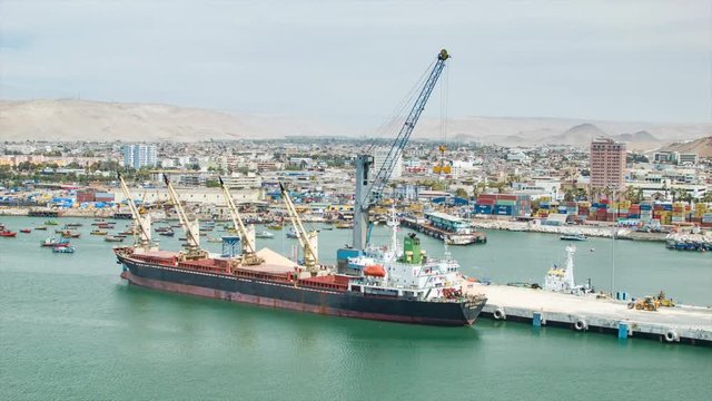 Port of Arica Chile with Ships and Boats in the Dock Harbour and a Desert City Background