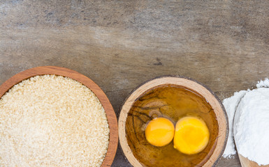 sugar egg flour on wood table