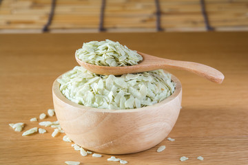 shredded rice grain on wood Bowl
