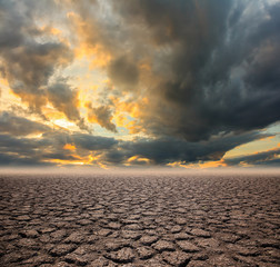 Obraz premium Drought land and Sunset sky background