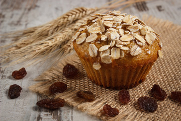 Fresh muffin with oatmeal baked with wholemeal flour and ears of rye grain, delicious healthy dessert