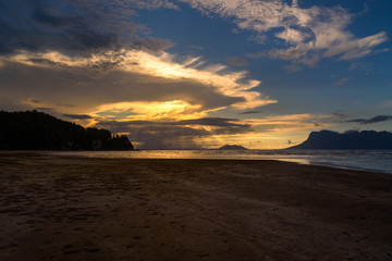 Tropical beach at low tide at sunset