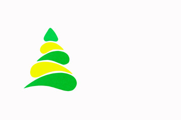 The New Year and Christmas conceptual tree made of a color cardboard. Isolated on a white background.