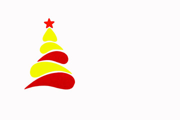 The New Year and Christmas conceptual tree made of a color cardboard. Isolated on a white background.