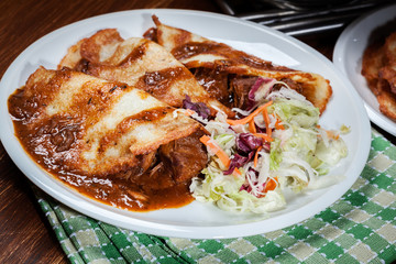 Potato pancakes with meat stew served