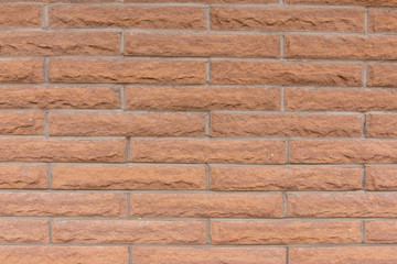Orange brick wall background.