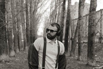 monochrome beard man listen music in park