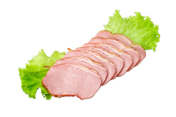 Sliced pork loin on a lettuce on a light background