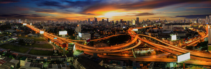 Traffic and light trails on the a highway loop at bangkok, Thailand