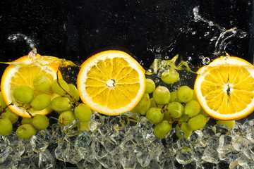 Obraz na płótnie Canvas Oranges, Water And Ice
