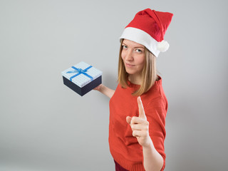 Young woman holding christmas gift