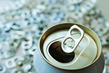 The empty beer canned and a lot of aluminum pull tabs, recycle idea