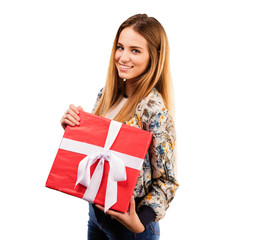 Fototapeta premium pretty young woman holding a gift