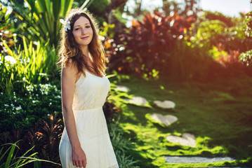 beautiful girl with Magnolia flower in hair