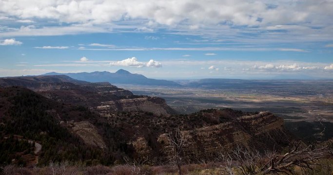 Mesa Verde National Park, Colorado, USA - view from Mesa Verde Park Point Overlook facing north at sunny day with moving clouds - Timelapse with zoom out 
