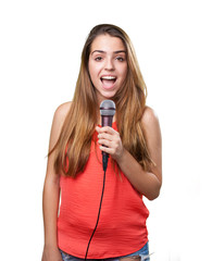 young woman singing with a microphone on white background