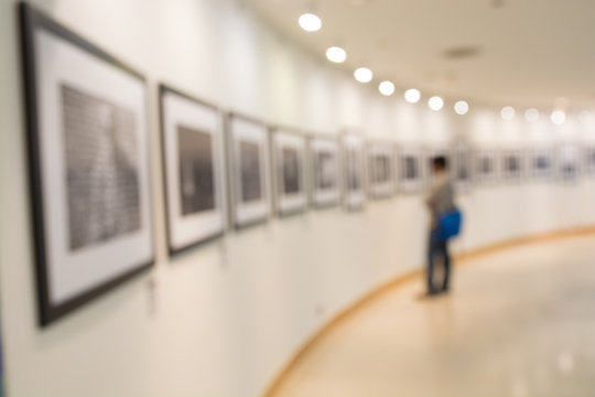 People Watching Photo in Art Gallery