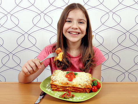 Happy Little Girl Eating Lazagne