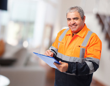 Portrait Of A Worker Writing On A Paper