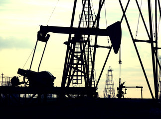 silhouette of oil rig at sunset the sun