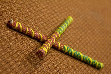 2 Dandiya sticks criss-crossed. Dandiya is the traditional folk dance of the state of Gujarat in India.