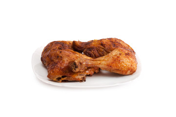 Photo baked chicken leg on a plate
