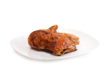 Photo baked chicken leg on a plate