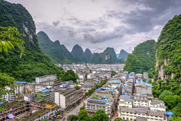 Foto op Canvas Skyline of Yangshuo city with karst landscape, China © dinozzaver