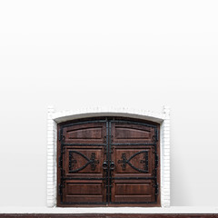 Old wooden gate in a white wall