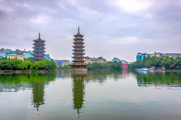 Fotobehang Two pagodas of Sun and Moon, Guilin, China © dinozzaver