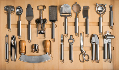 a set of kitchen utensils in a wooden box