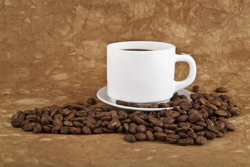 cup with hot coffee and grains