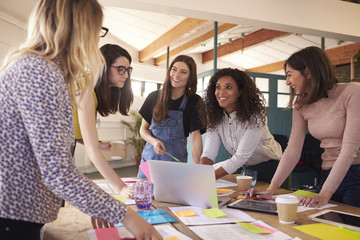 Female Designers Having Brainstorming Meeting In Office