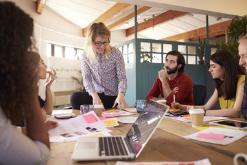Female Manager Leads Brainstorming Meeting In Design Office