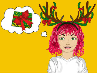 Happy little girl with Christmas deer horns on his head. 