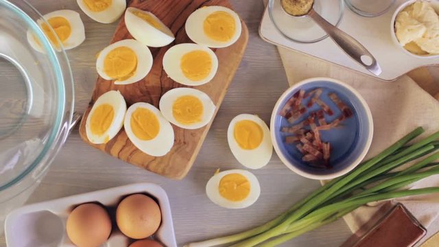 Preparing deviled eggs with organic eggs for appetizer. Step by step recipe