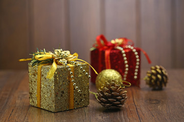 Christmas gift box and decorations on wood desk